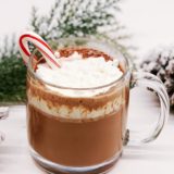 Homemade hot chocolate with candy cane simple syrup and fresh whipped cream.