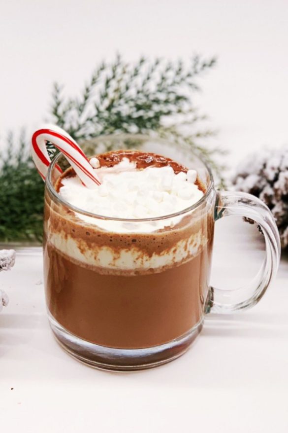 Homemade hot chocolate with candy cane simple syrup and fresh whipped cream.