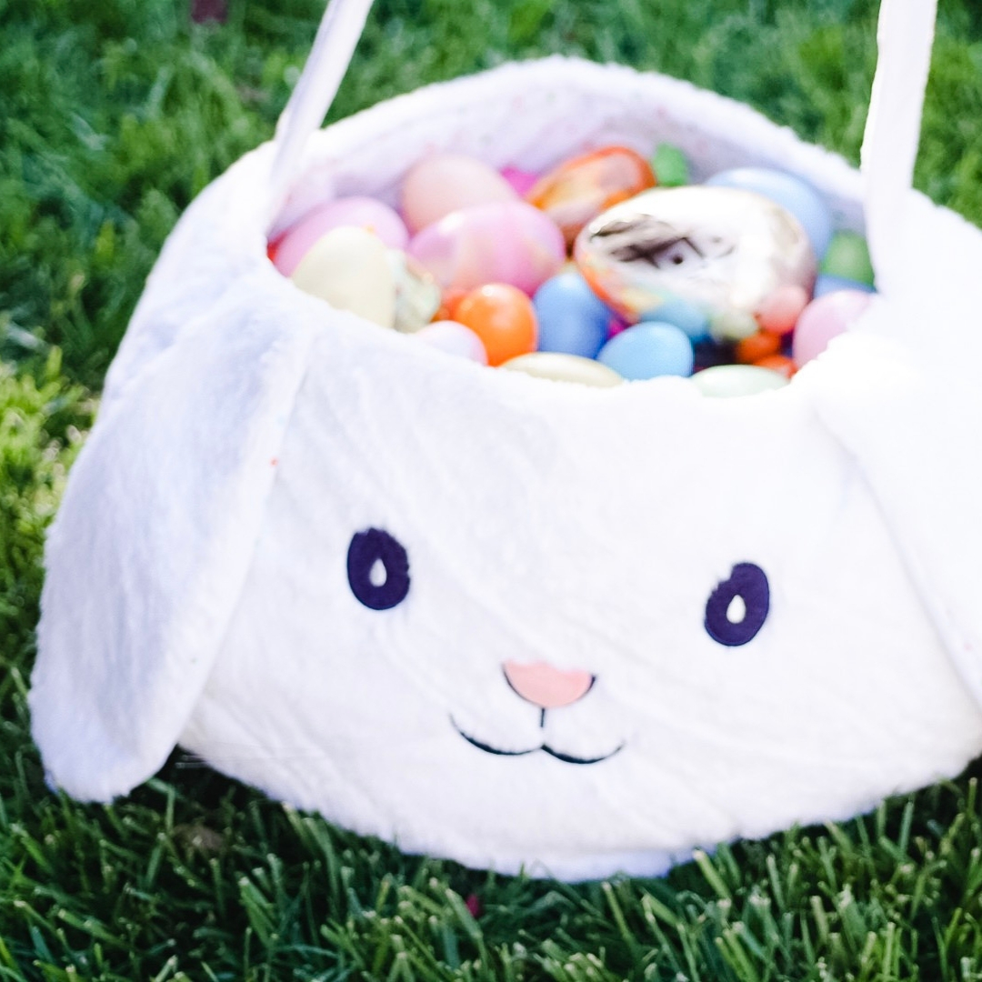 Easter bunny basket filled with eggs and one golden egg. Egg hunt filler ideas. | Fiestanosiesta.com