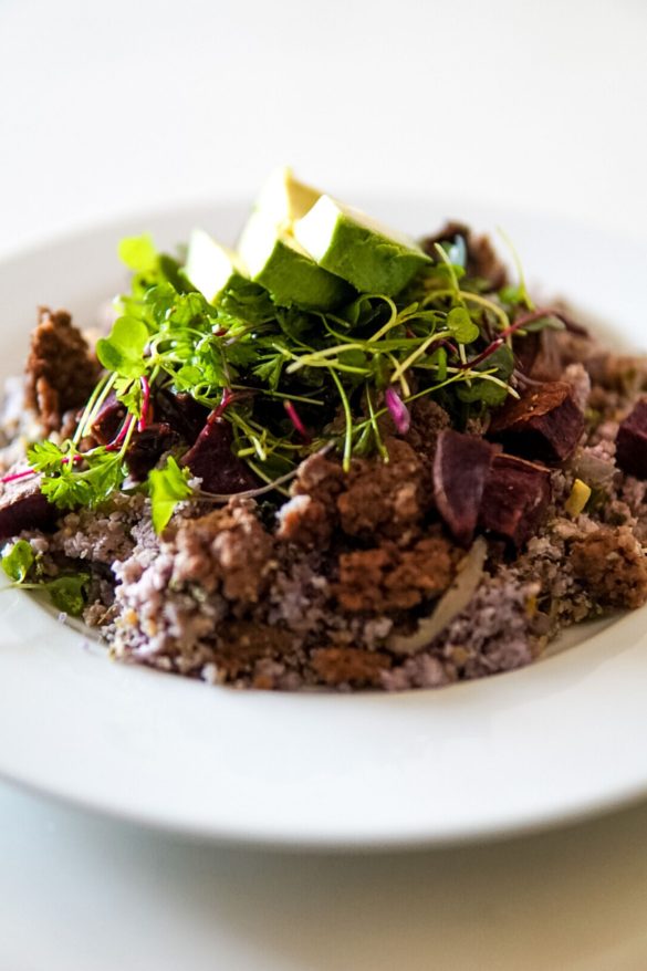 purple cauliflower rice bowl with ground venison, purple potatoes, microgreens and sundried tomatoes