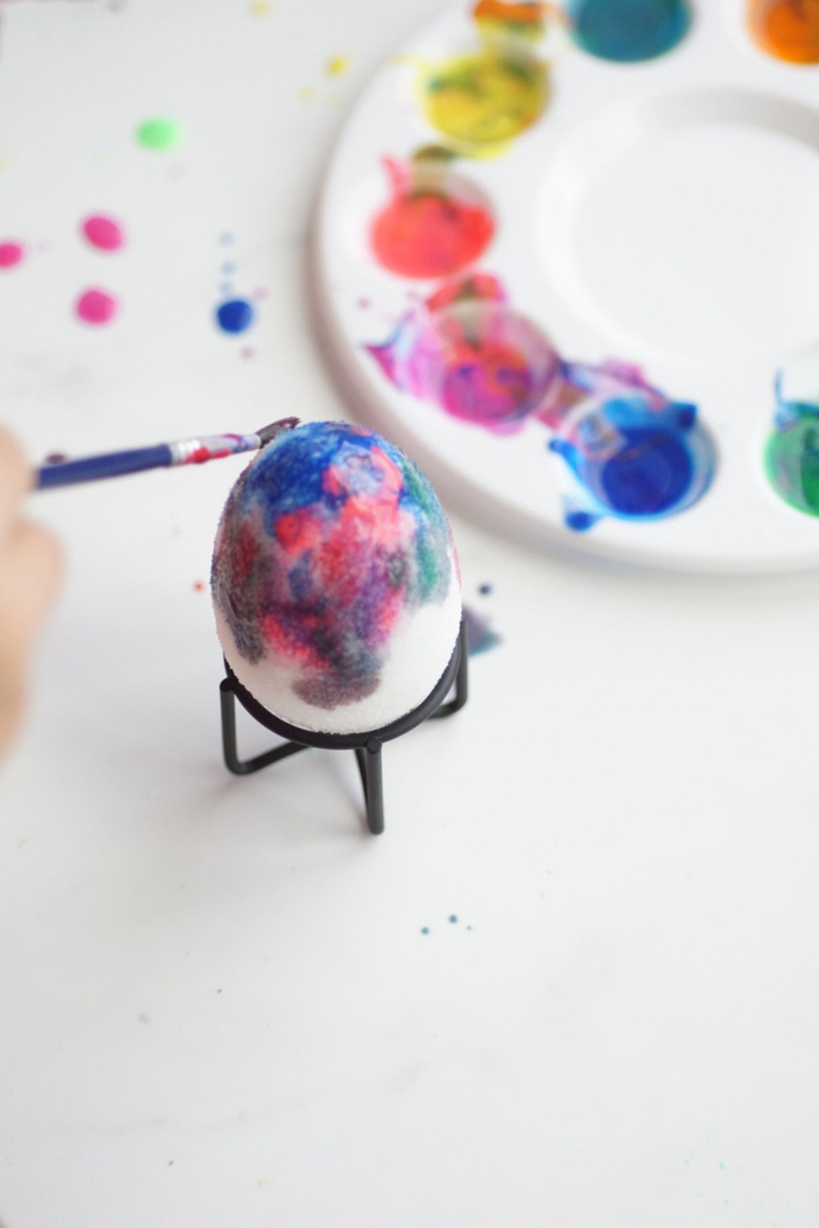 painting sugar covered plastic easter eggs with finger paint