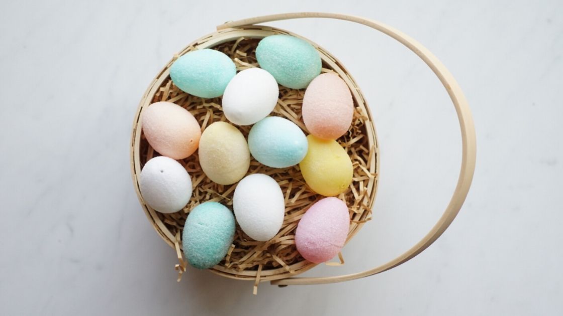 Sugar covered plastic easter eggs in a basket ready to paint