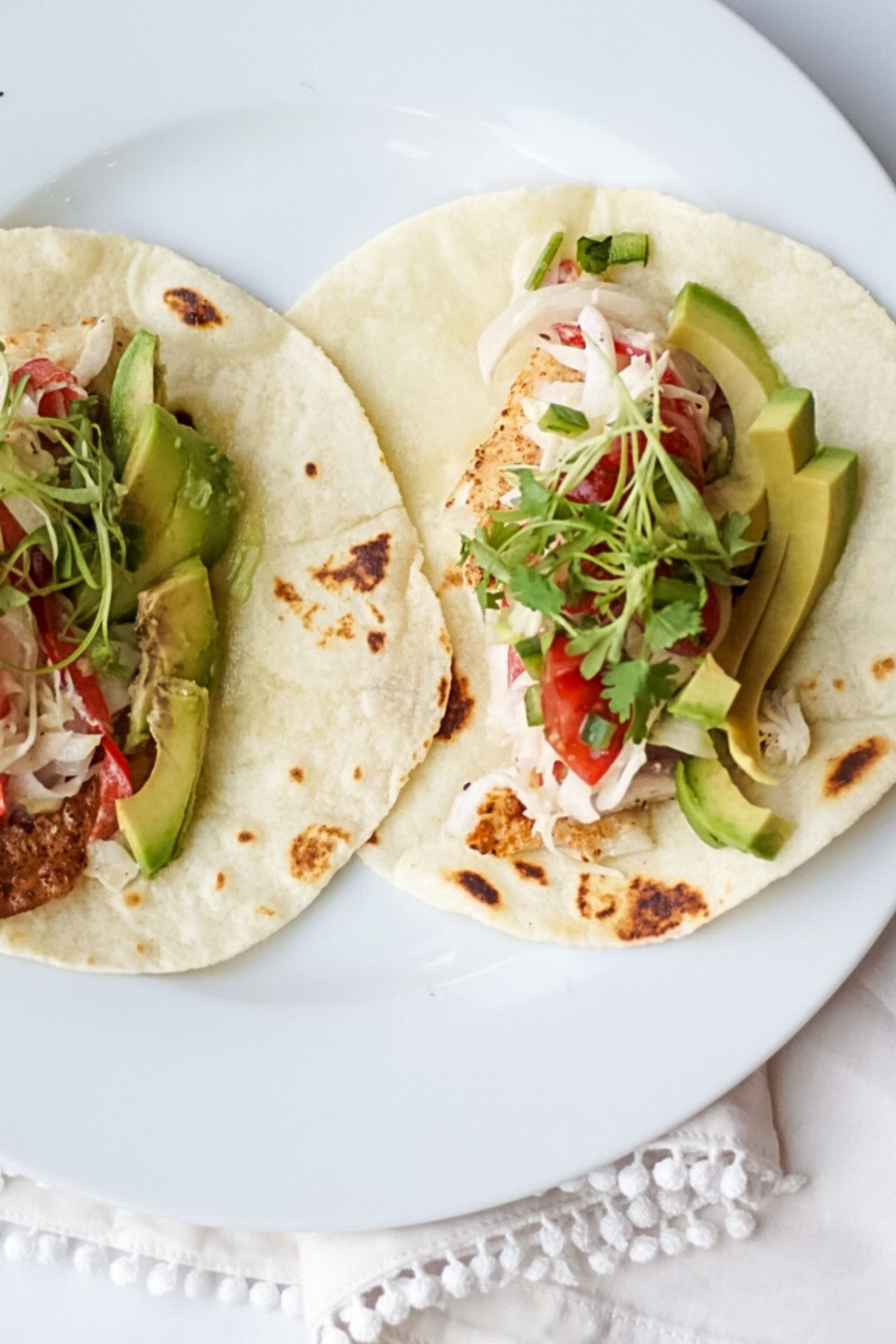 Striped bass fish tacos with bell pepper citrus slaw and grape tomato pico de gallo recipe