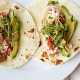 Striped bass fish tacos with bell pepper citrus slaw and grape tomato pico de gallo - gluten free recipe