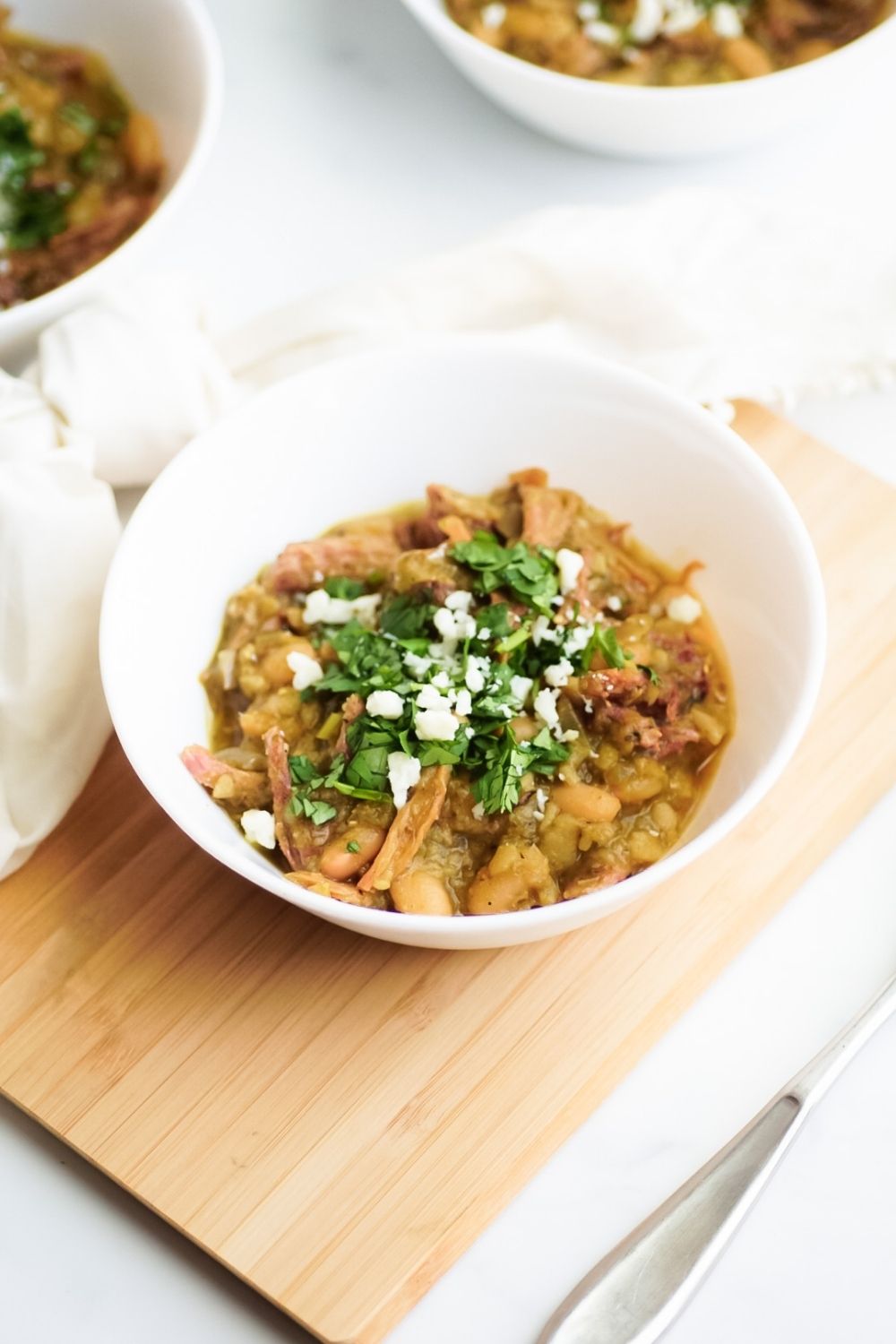 Chili with fried carnitas and chile verde sauce