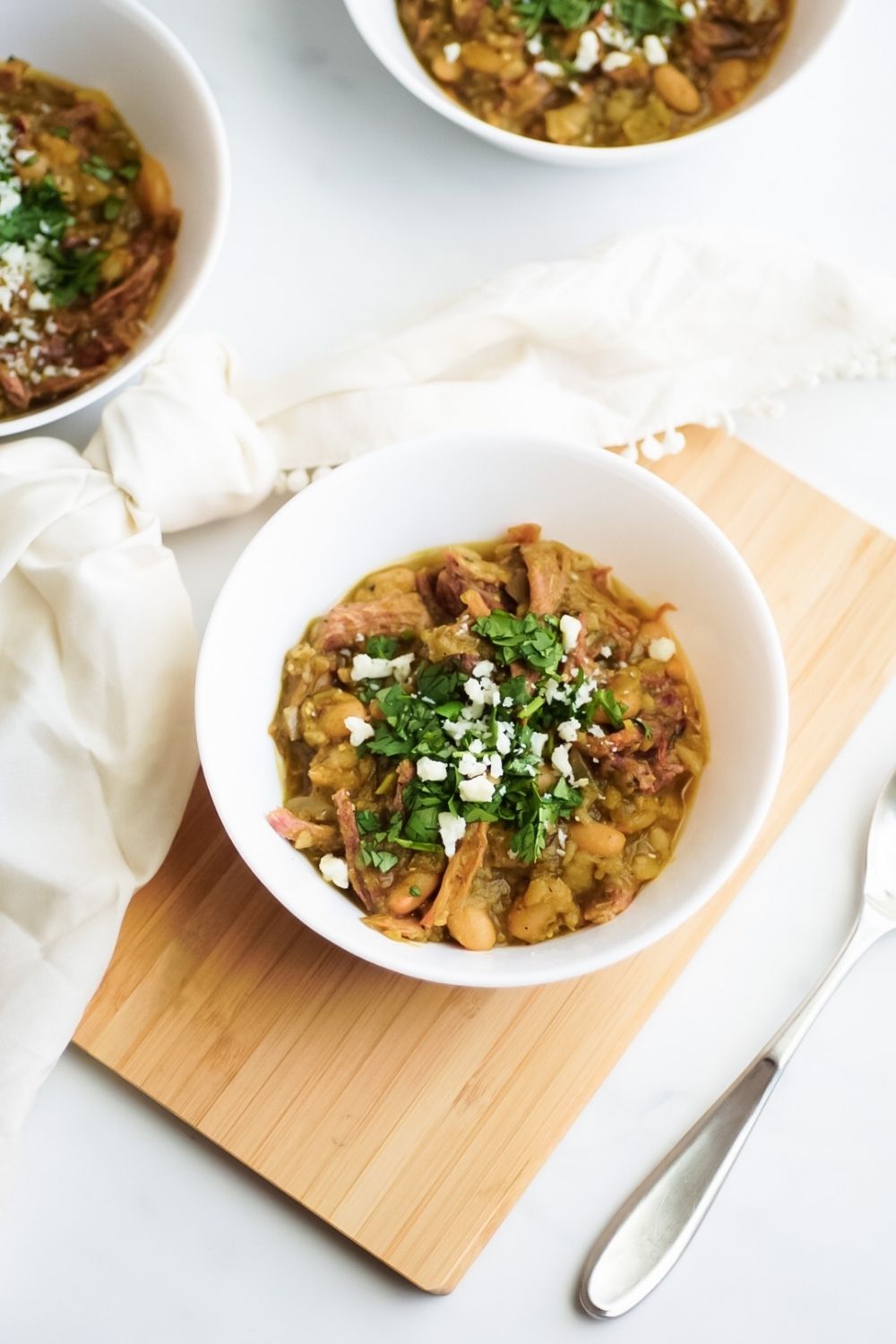 Chili with fried carnitas and chile verde sauce