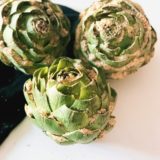 Stuffed artichokes with hot Italian sausage A twist on a classic recipe. Fiestanosiesta.com