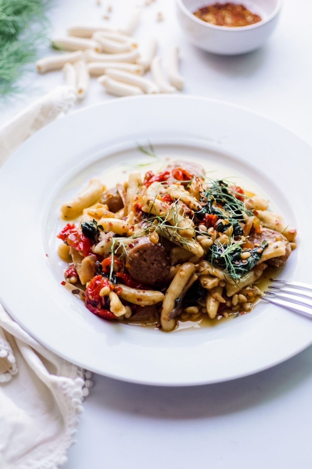 Easy Recipe for Homemade Pasta with Hot Italian sausage, Fennel, Kale, Sun-Dried Tomatoes, and Pine Nuts