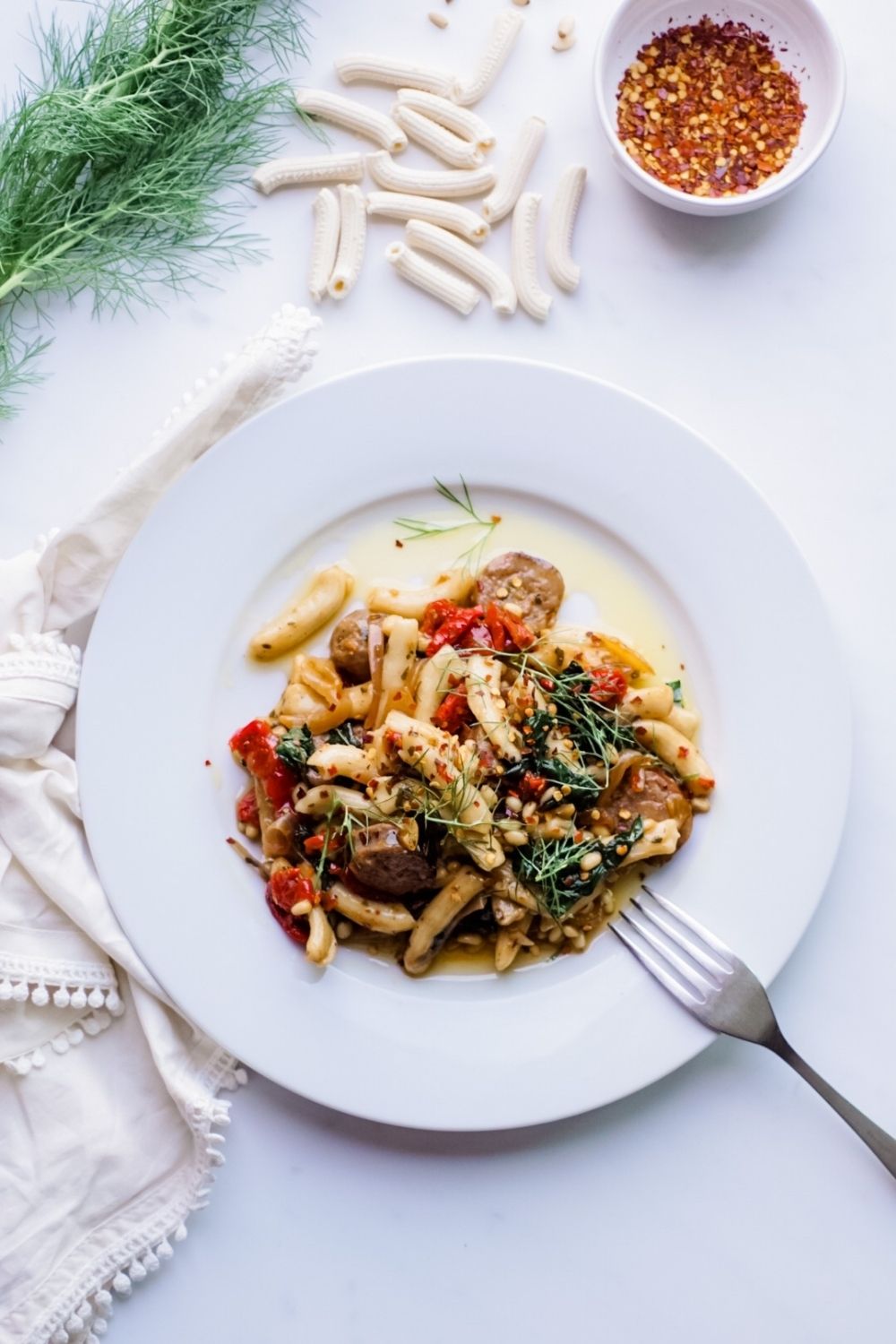 Easy Recipe for Homemade Pasta with Hot Italian sausage, Fennel, Kale, Sun-Dried Tomatoes, and Pine Nuts